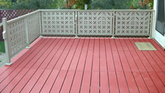 Versadeck aluminum modular decking photo showing the Terra Cotta color option and privacy aluminum railing.